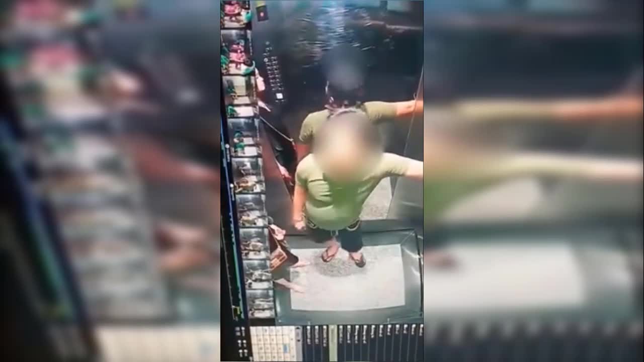 Lại xuất hiện clip người phụ nữ che chắn để người đàn ông đi tè trong thang máy chung cư